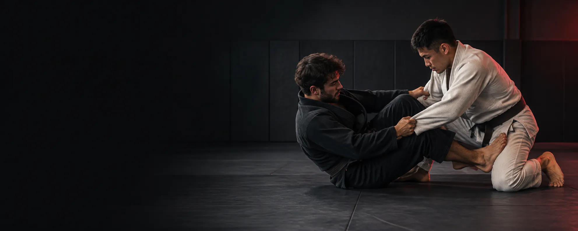students practicing jiu-jitsu on the mats